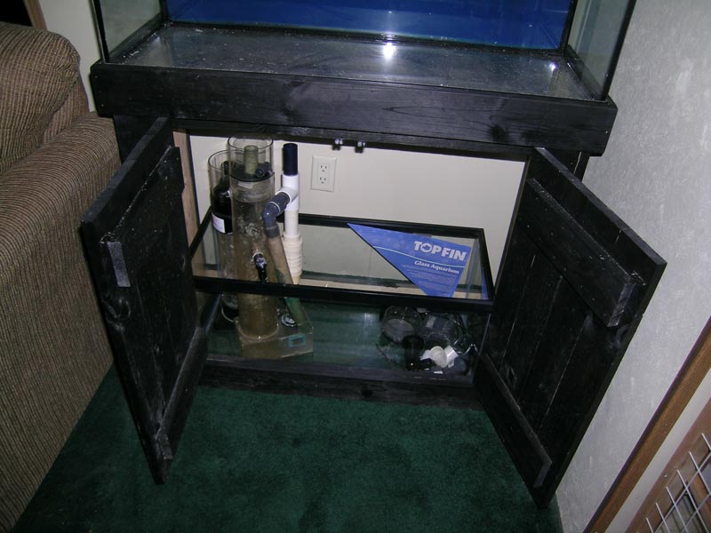 the stand opened up showing the 20g fuge/sump.